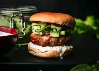 Elevate your burger experience with these delicious, protein-packed turkey burgers served with a refreshing cucumber relish for flavor.